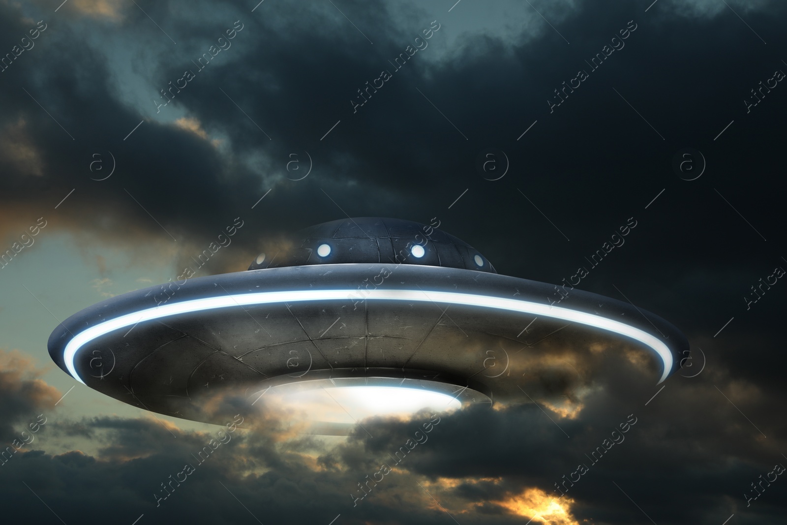 Image of UFO. Alien spaceship among clouds in sky. Extraterrestrial visitors