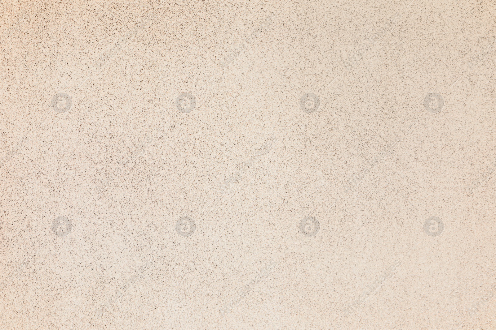 Photo of Texture of beige plaster wall as background