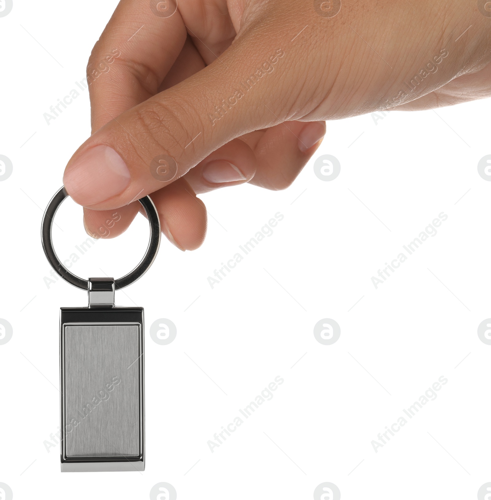 Photo of Woman holding metallic keychain on white background, closeup