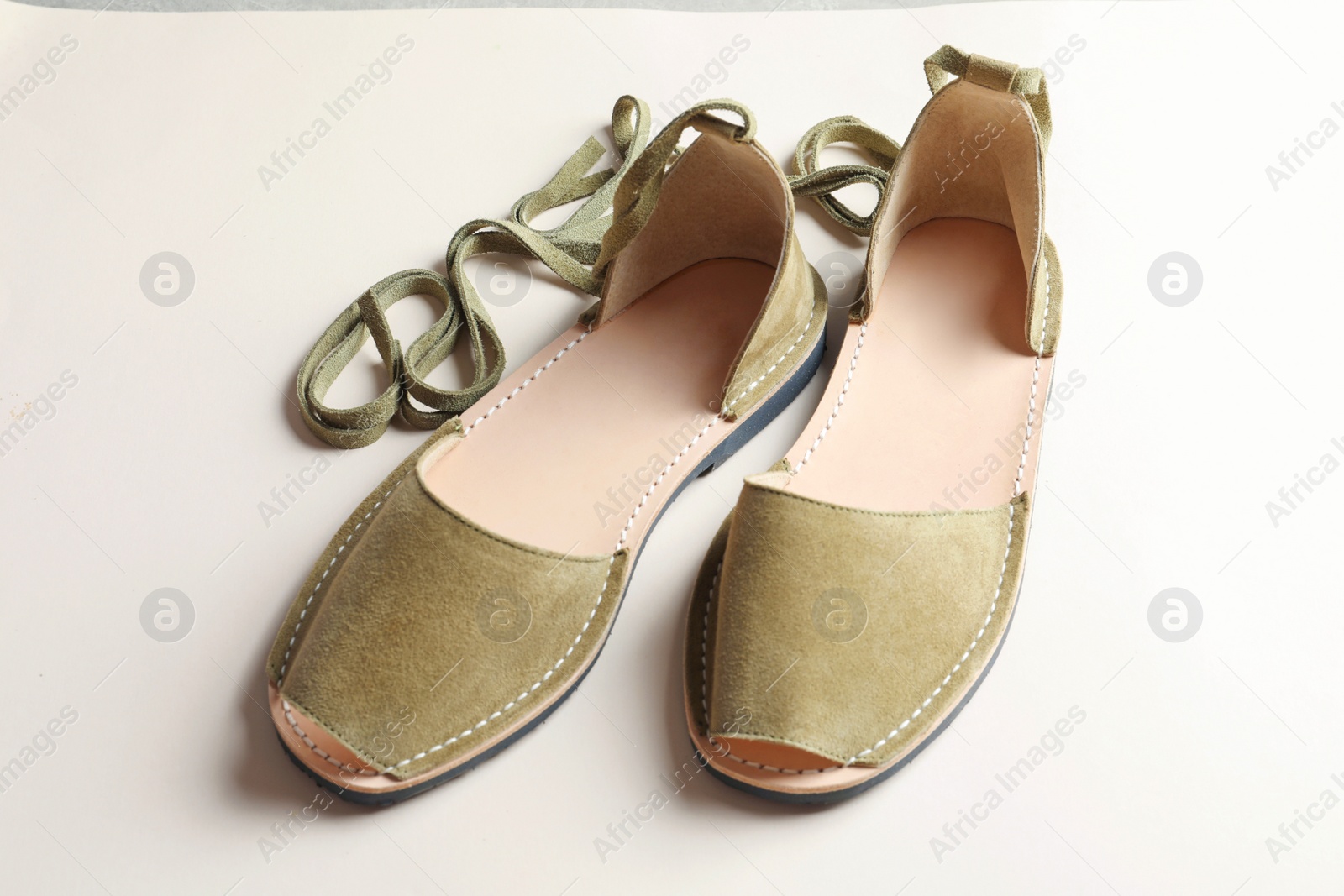 Photo of Pair of trendy women's shoes on light background