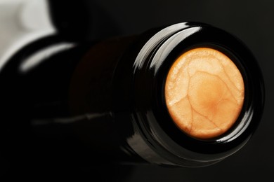 Closeup view of cork in wine bottle on grey background, space for text