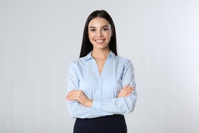 Portrait of young businesswoman on white background