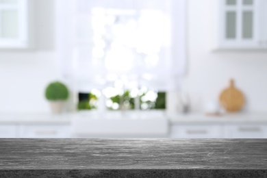 Image of Textured table in light kitchen. Space for design