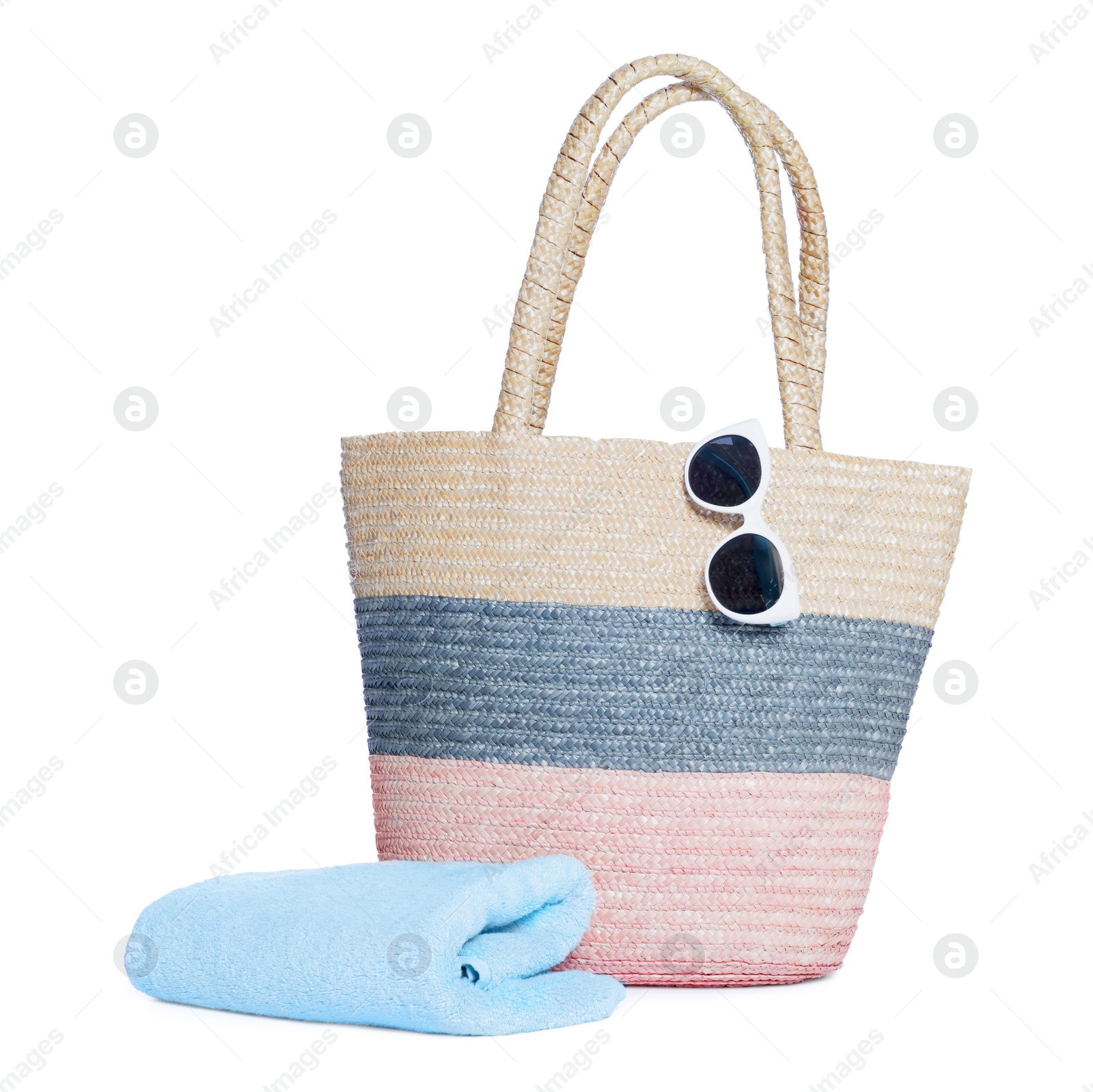 Photo of Beach bag, sunglasses and towel isolated on white