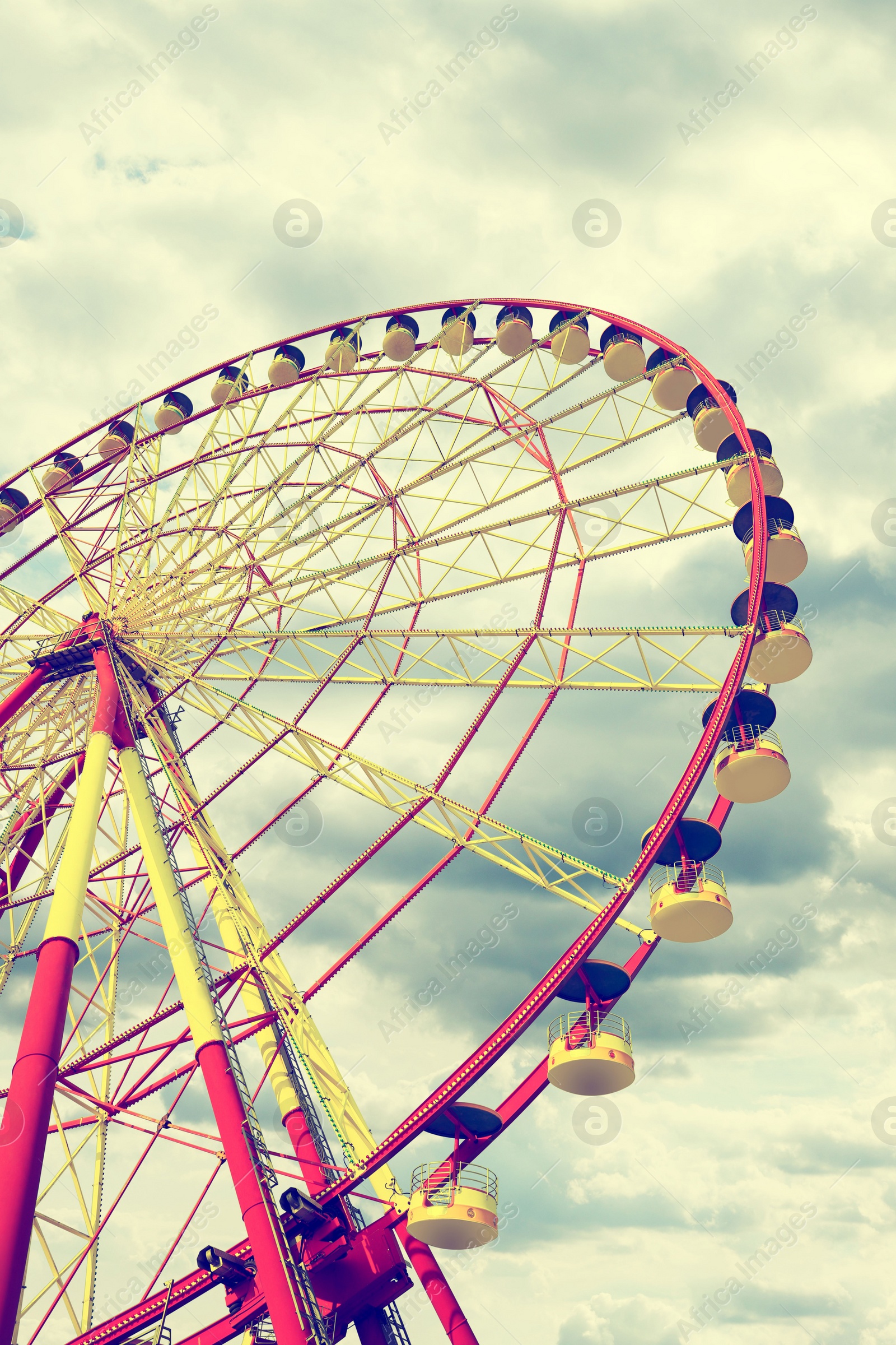 Image of Beautiful large Ferris wheel outdoors, low angle view