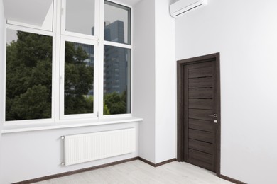 Photo of Empty office room with clean window and door. Interior design