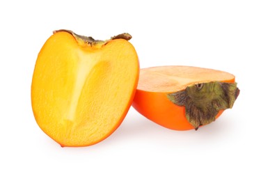 Photo of Halves of delicious ripe juicy persimmons on white background