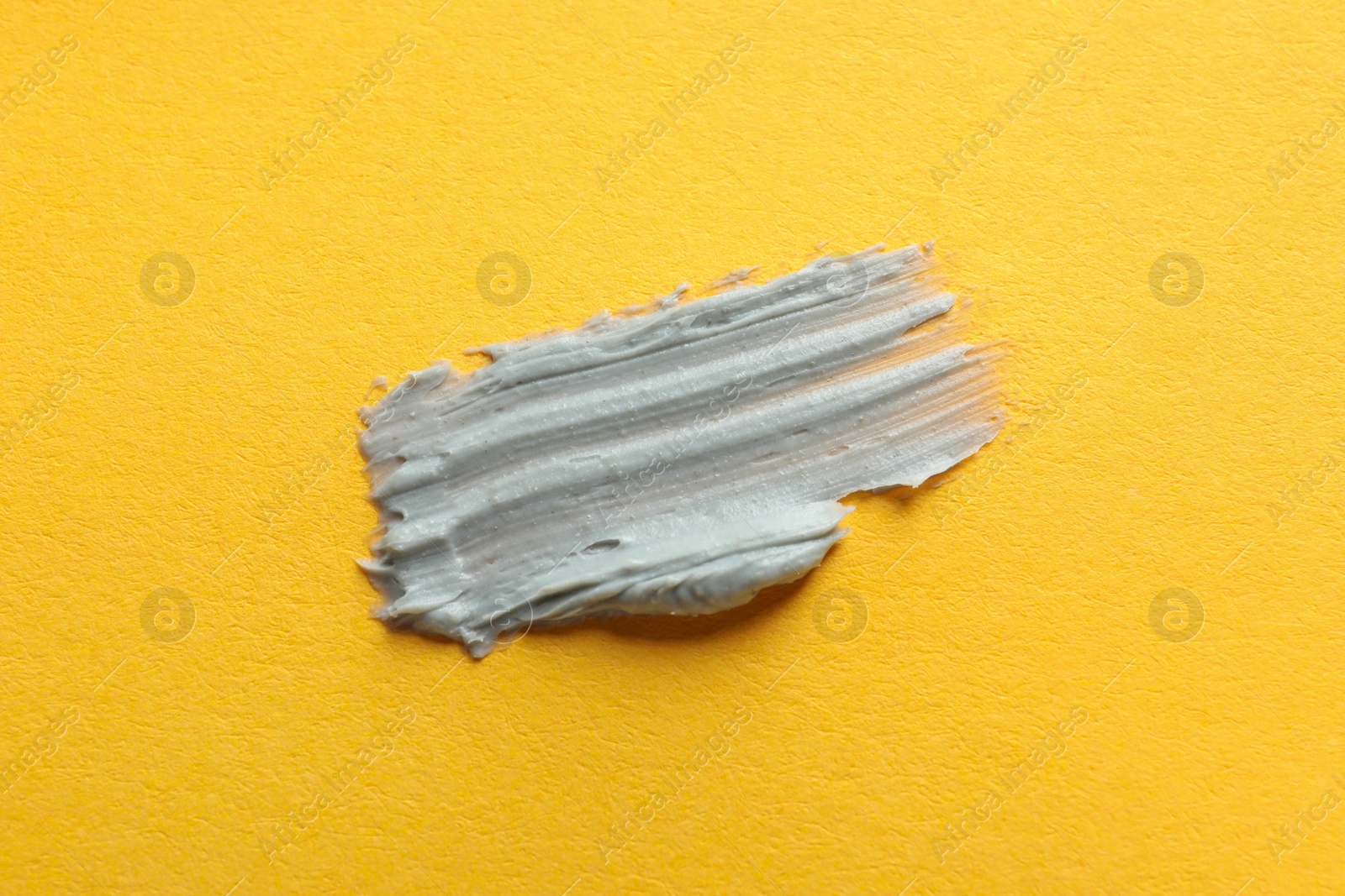 Photo of Sample of face mask on orange background, top view