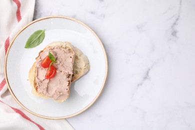 Photo of Delicious liverwurst sandwich with tomatoes and basil on white marble table, flat lay. Space for text