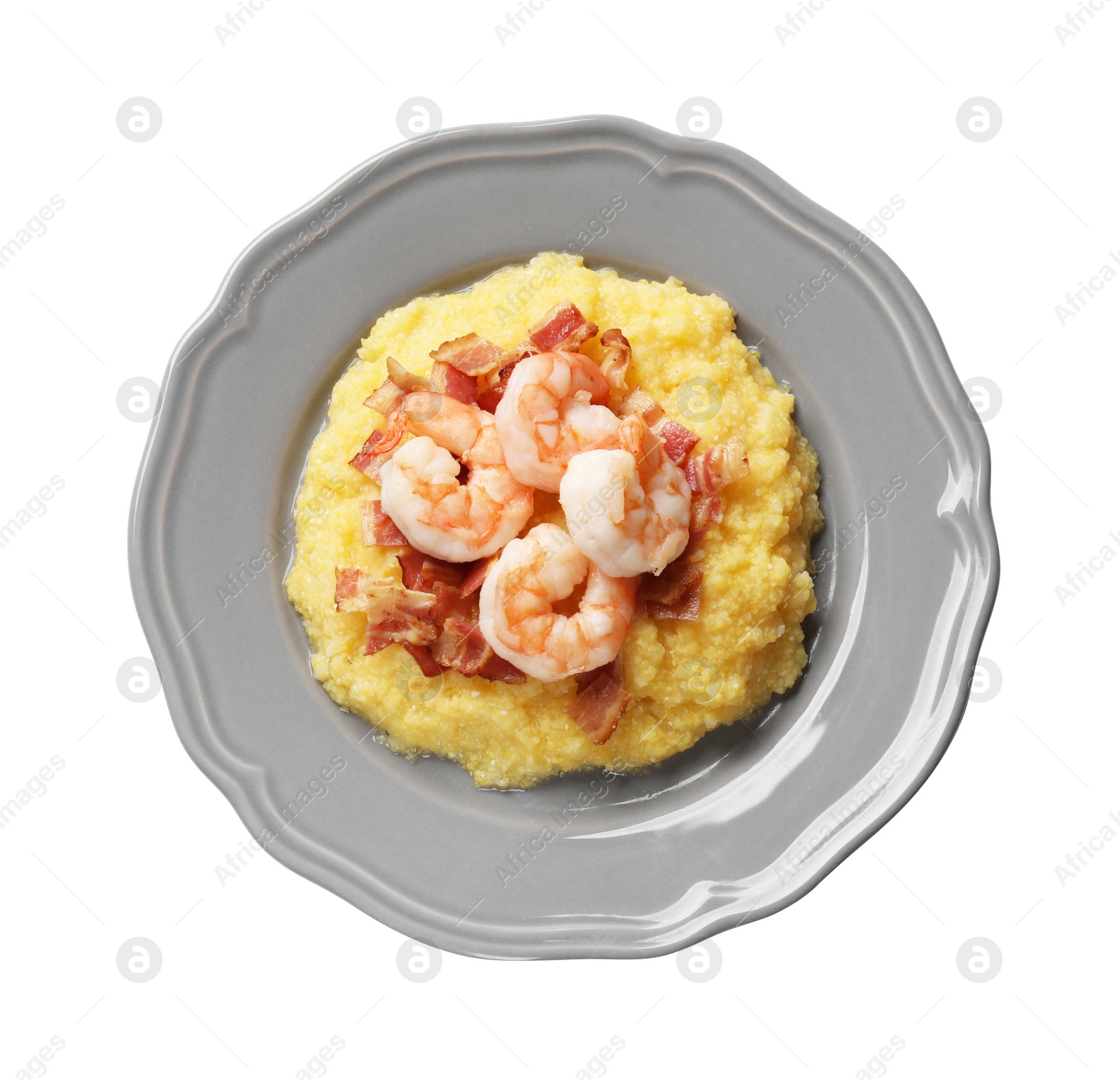 Photo of Plate with fresh tasty shrimps, bacon and grits isolated on white, top view