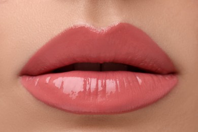 Woman wearing beautiful lip gloss, closeup view