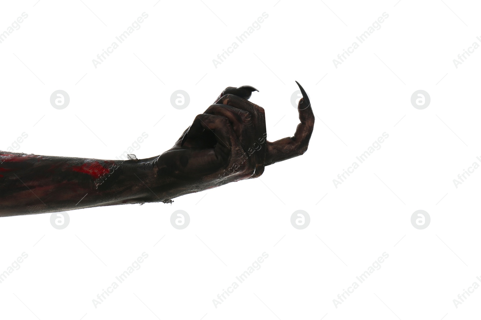 Photo of Scary monster on white background, closeup of hand. Halloween character