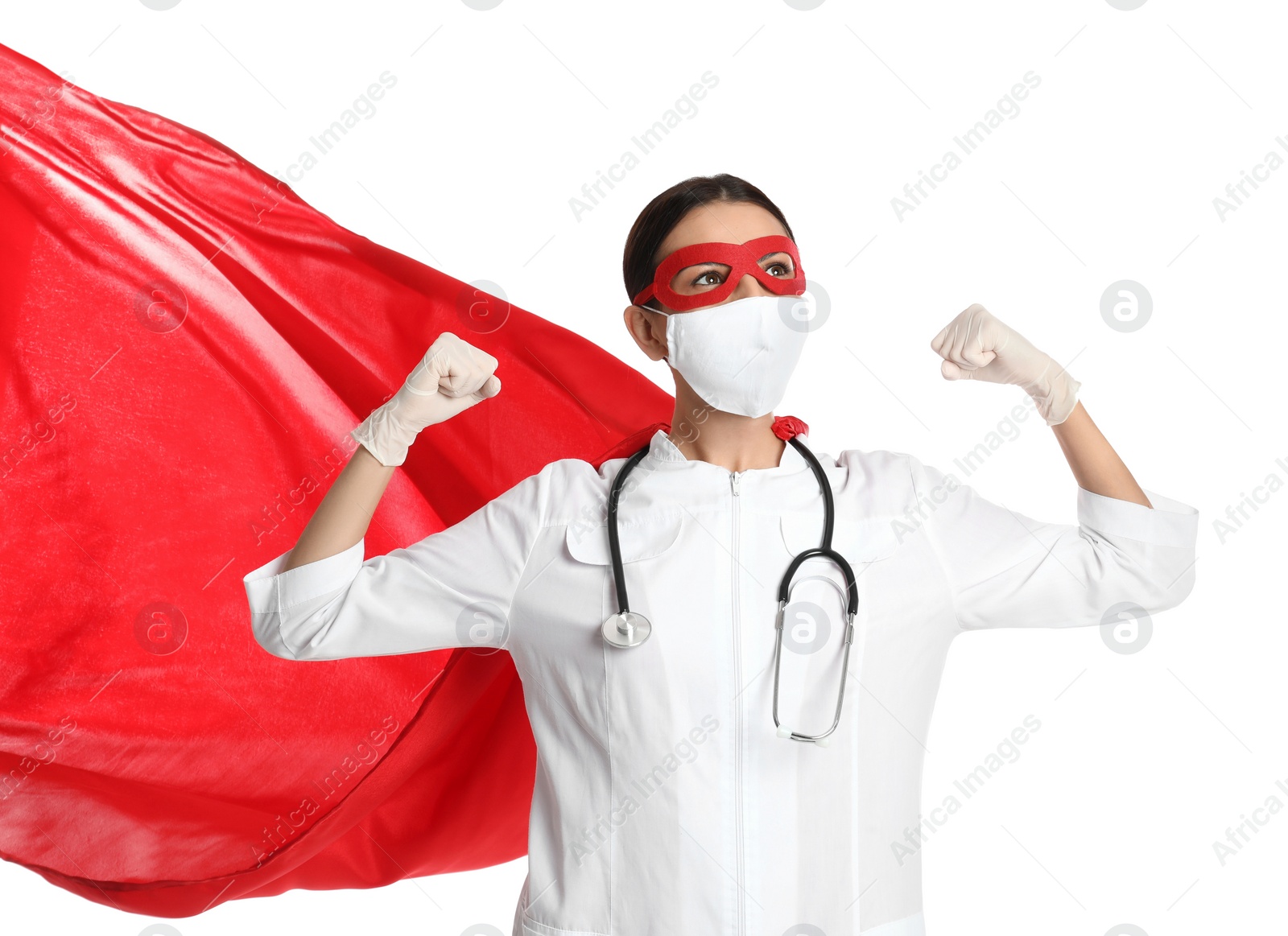 Photo of Doctor dressed as superhero posing on white background. Concept of medical workers fighting with COVID-19