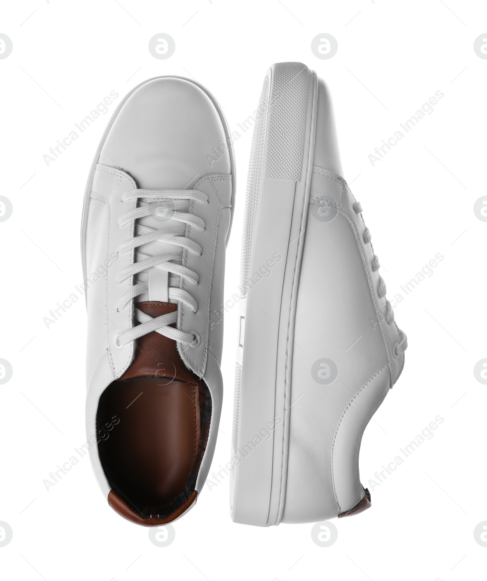 Photo of Pair of stylish sports shoes on white background, top view