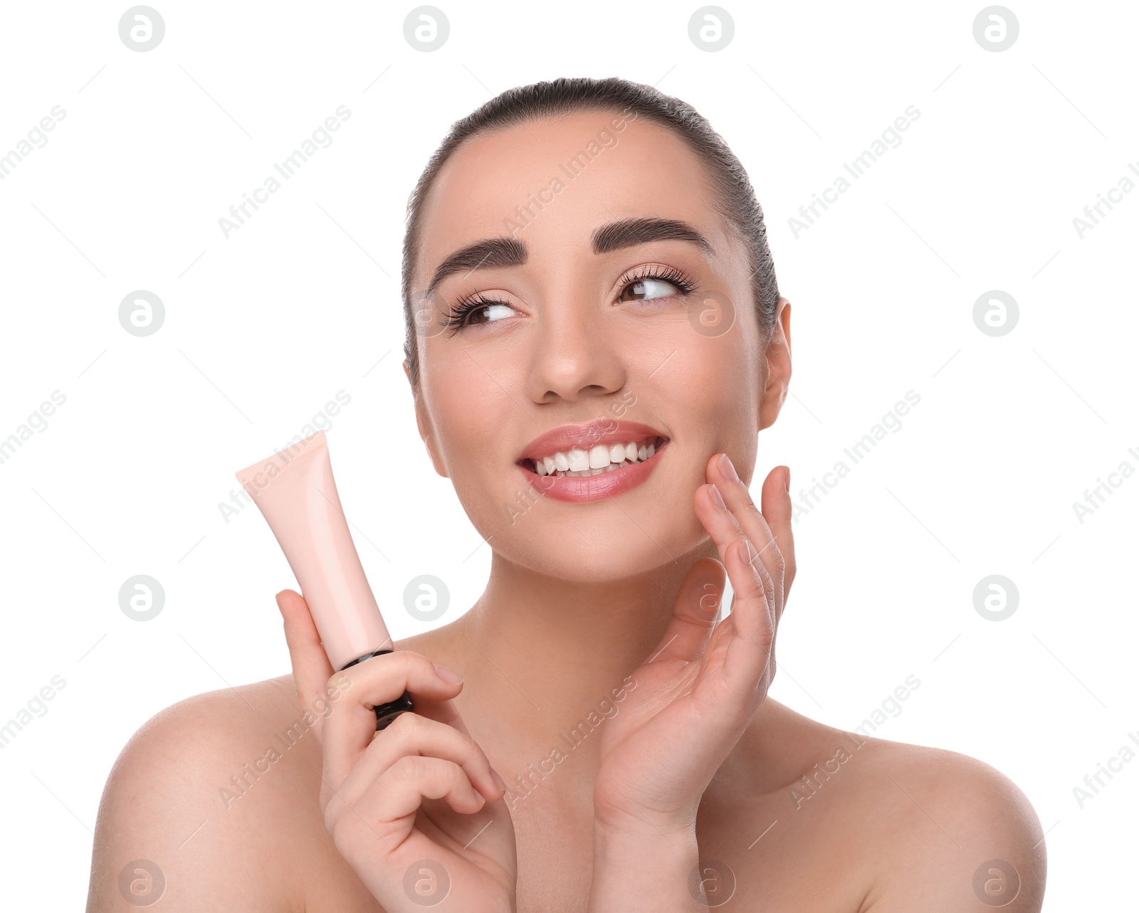 Photo of Woman holding tube of foundation on white background