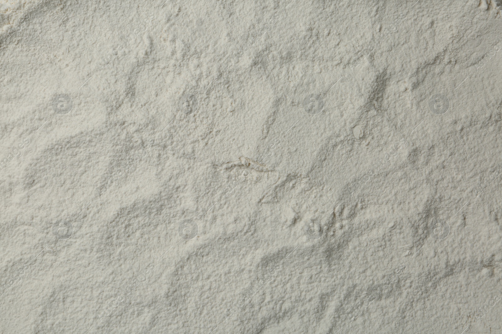 Photo of Pile of organic flour as background, top view