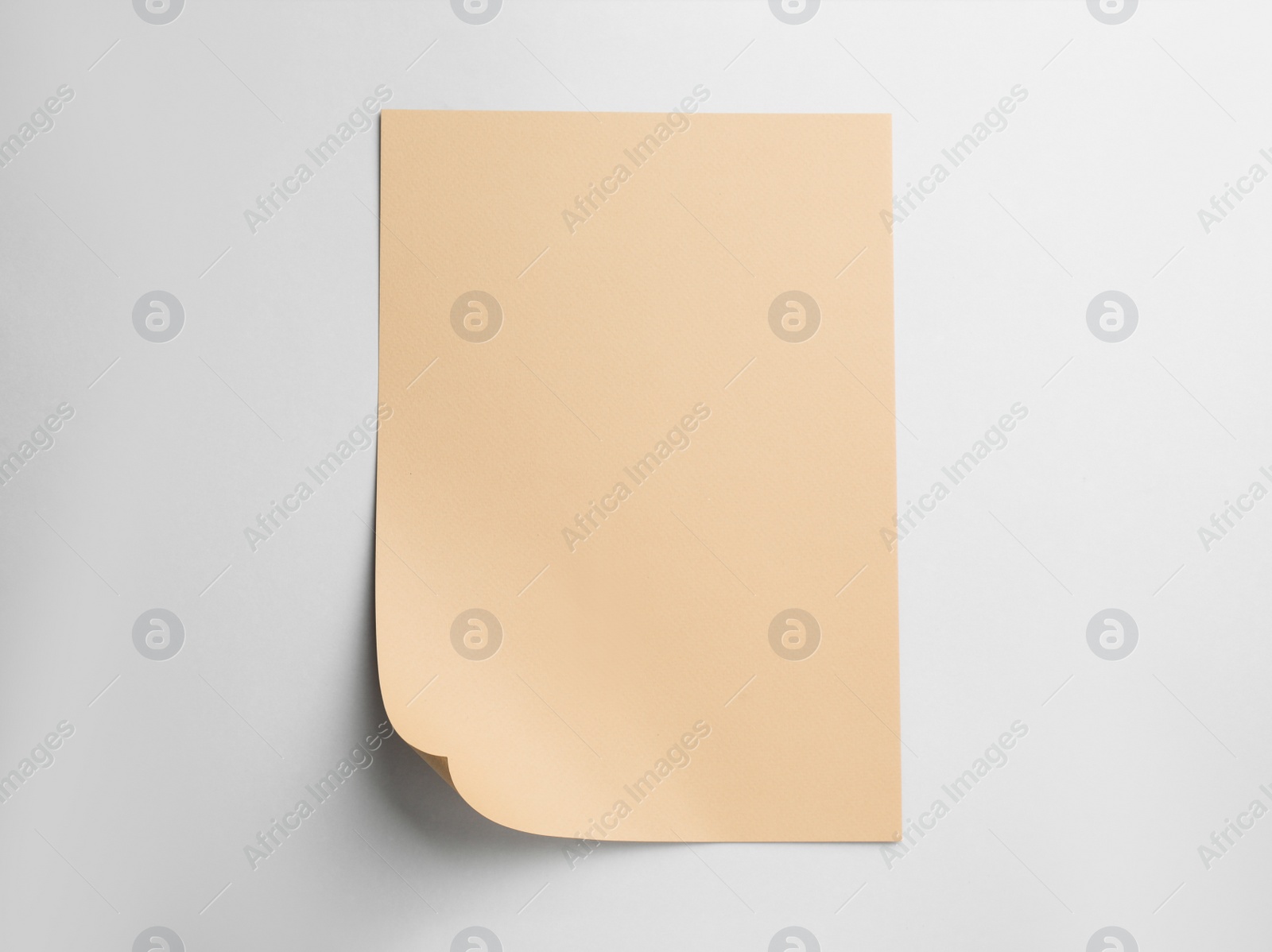 Photo of Sheet of brown paper on white background, top view