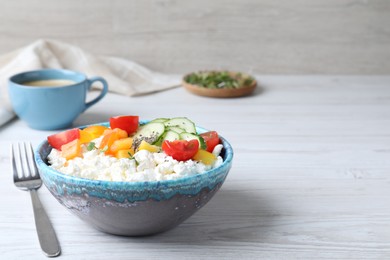 Photo of Delicious cottage cheese with vegetables and chia seeds served on white wooden table, space for text. Tasty breakfast