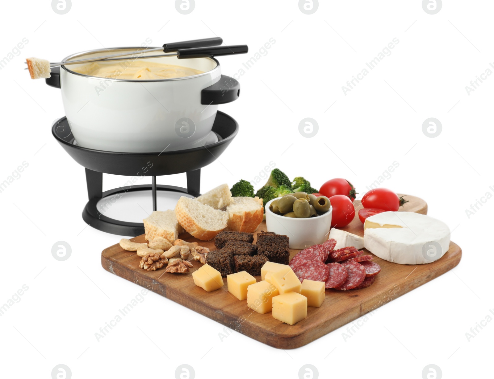 Photo of Fondue with tasty melted cheese, forks and different snacks isolated on white