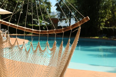 Photo of Hammock near pool with clean water outdoors, closeup