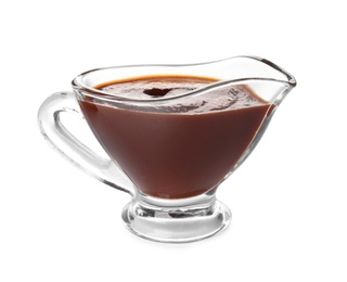 Photo of Glass gravy boat with barbecue sauce on white background