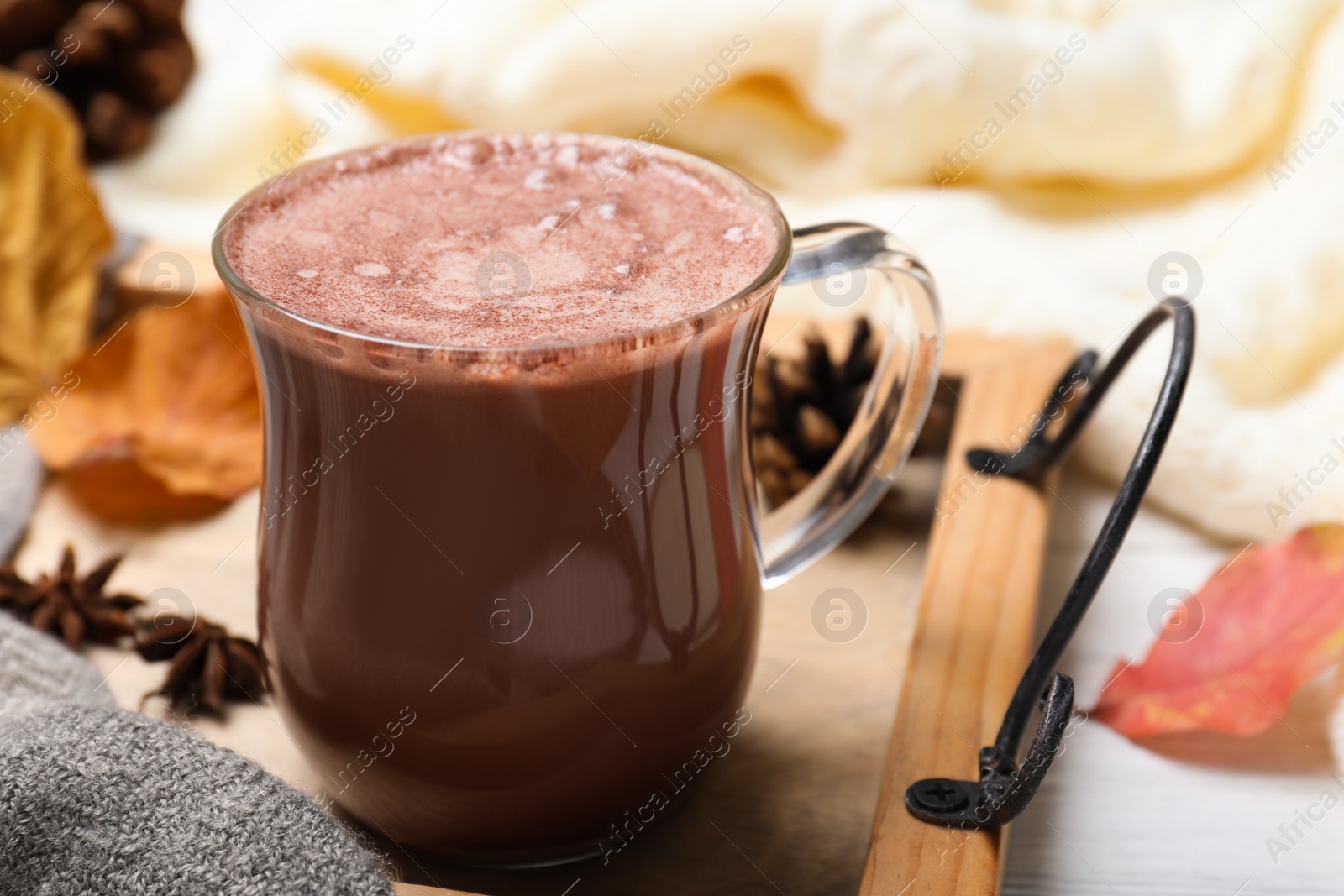 Photo of Cup of hot drink on white table, closeup. Cozy autumn atmosphere