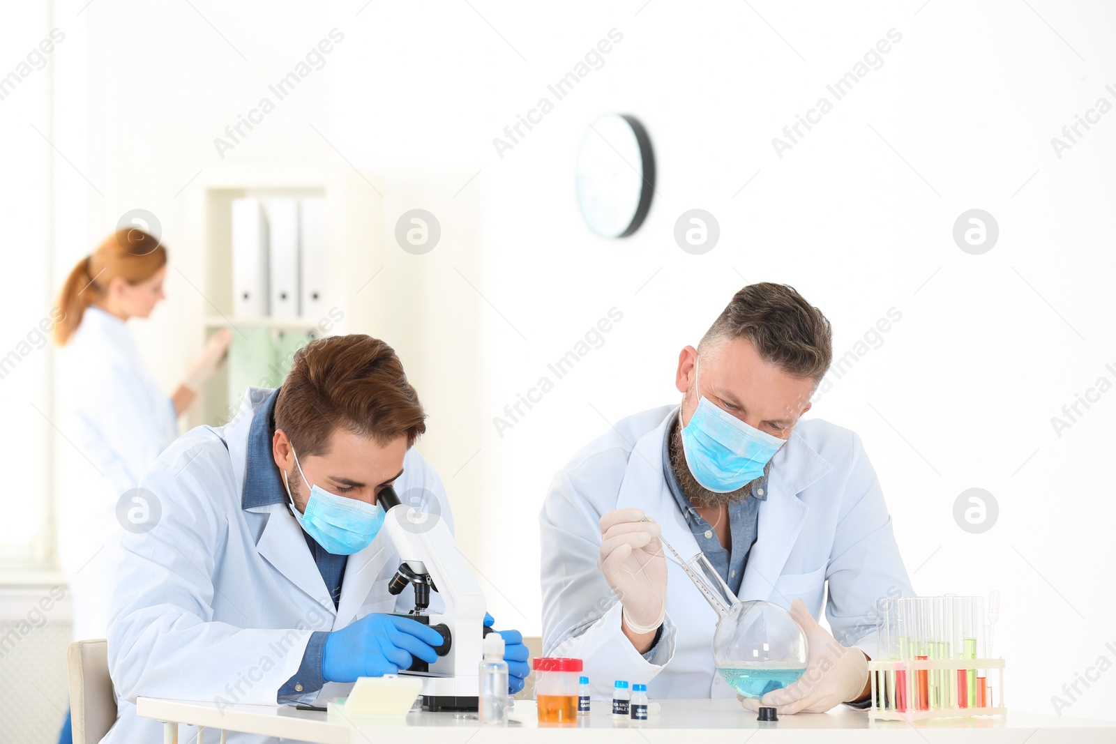 Photo of Scientists working in laboratory. Research and analysis