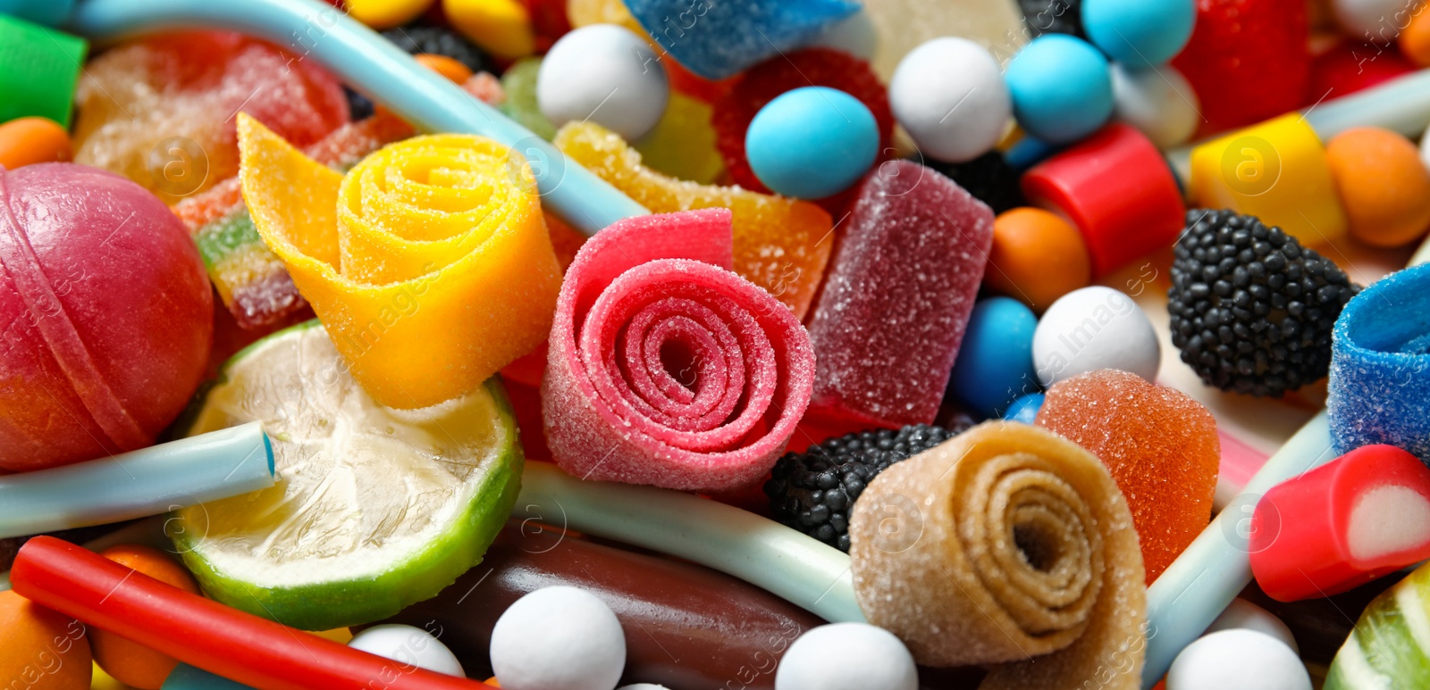 Image of Many different yummy candies as background. Banner design 