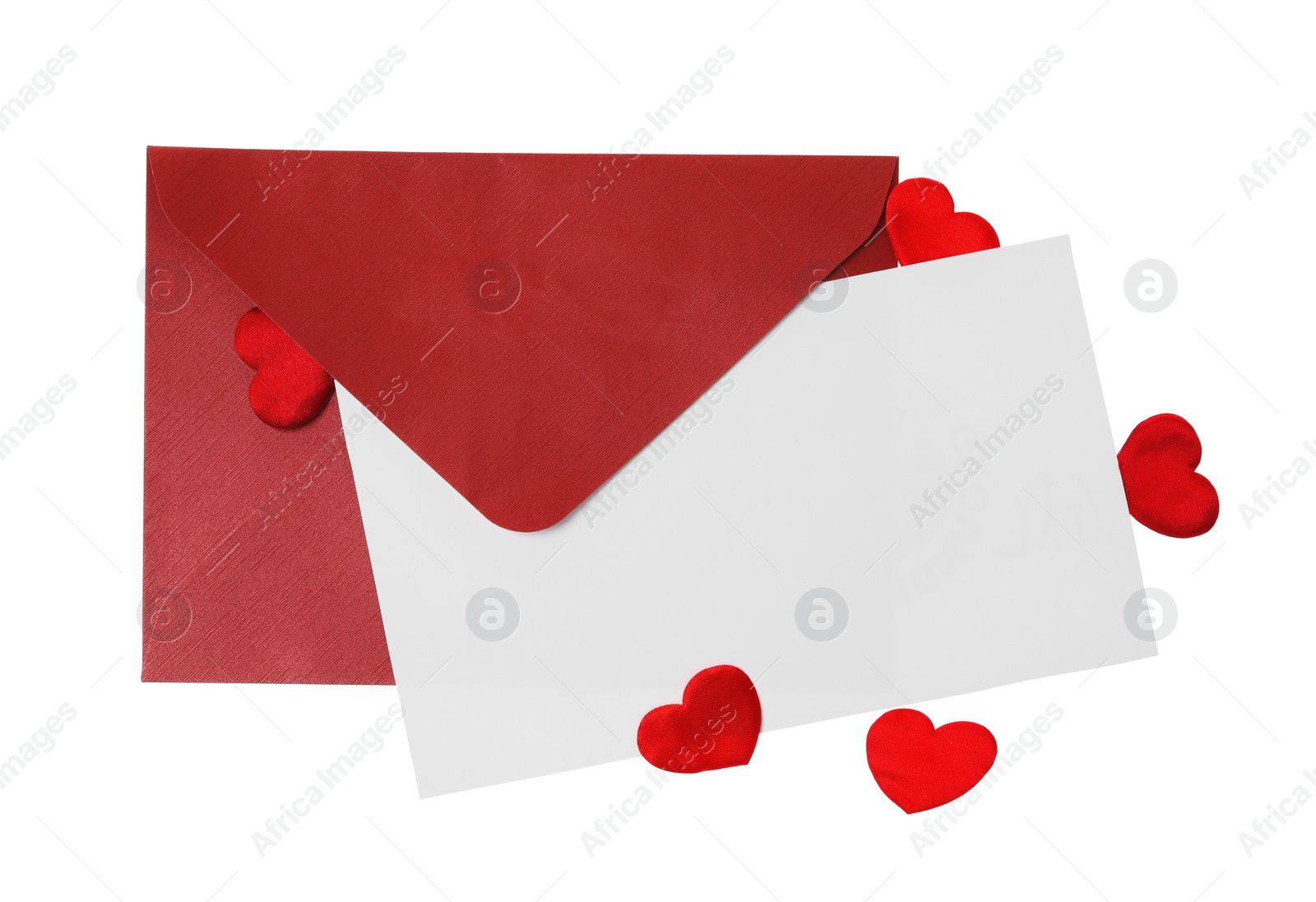 Photo of Blank card, envelope and red decorative hearts on white background, top view. Valentine's Day celebration