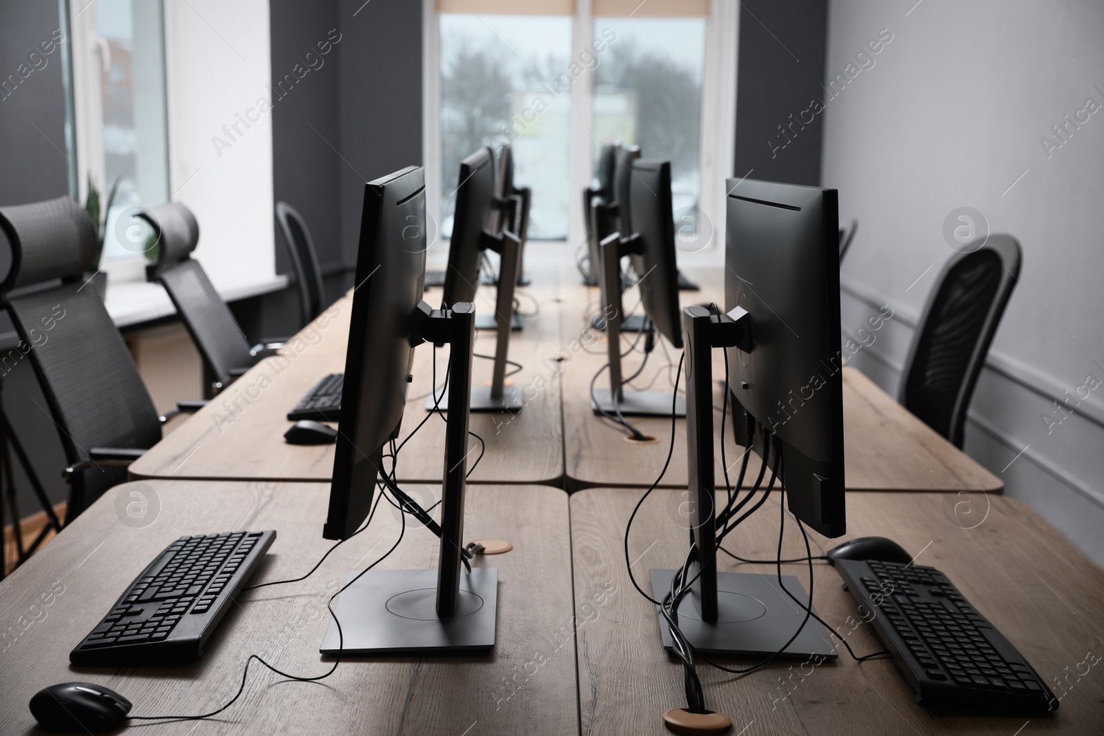 Photo of Many modern computers in open space office