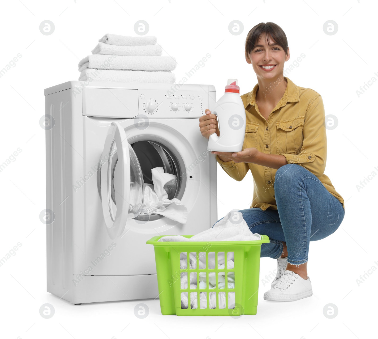 Photo of Beautiful woman with detergent near washing machine on white background