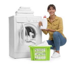 Photo of Beautiful woman with detergent near washing machine on white background