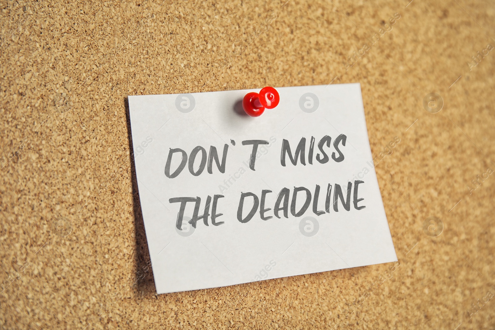 Image of Note with reminder Don't Miss The Deadline attached to cork board