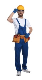 Photo of Professional builder in uniform with tool belt isolated on white