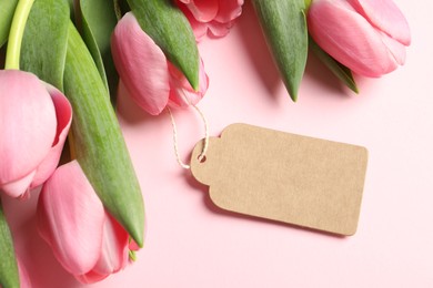 Photo of Happy Mother's Day. Beautiful flowers with blank card on pink background, closeup