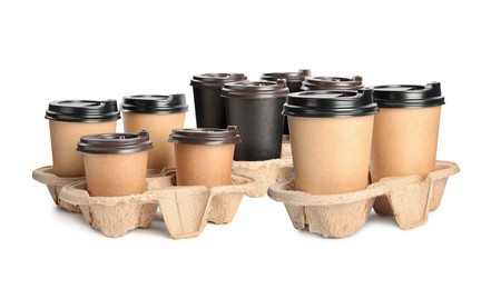 Image of Set of different paper takeaway cups on white background