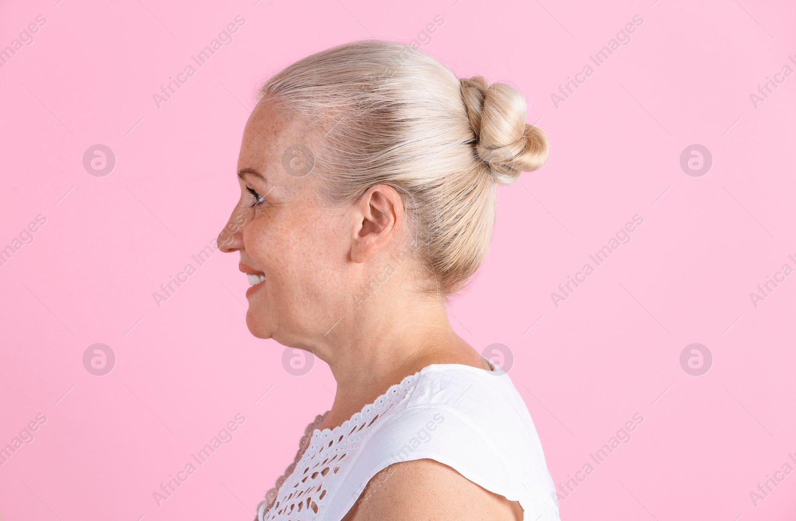 Photo of Mature woman on color background. Hearing problem