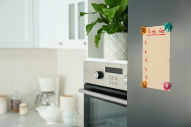 Photo of Blank to do list on fridge in kitchen. Space for text
