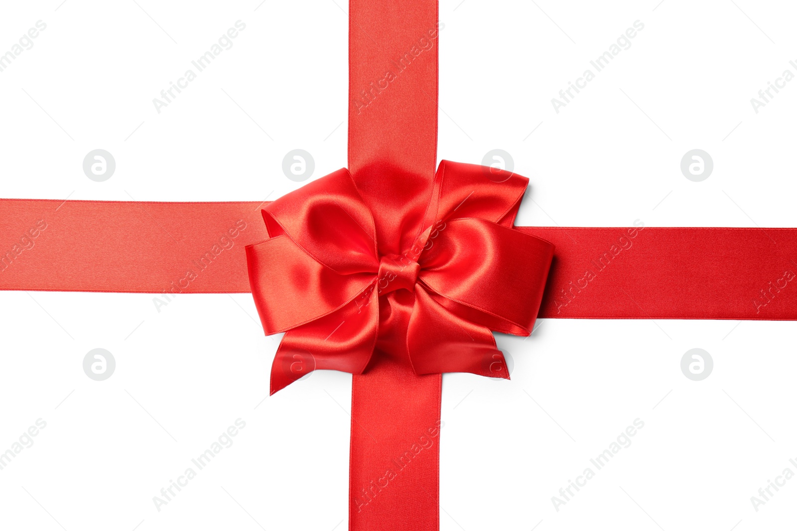 Photo of Red ribbon with bow on white background. Festive decoration