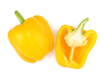 Whole and cut yellow bell peppers isolated on white