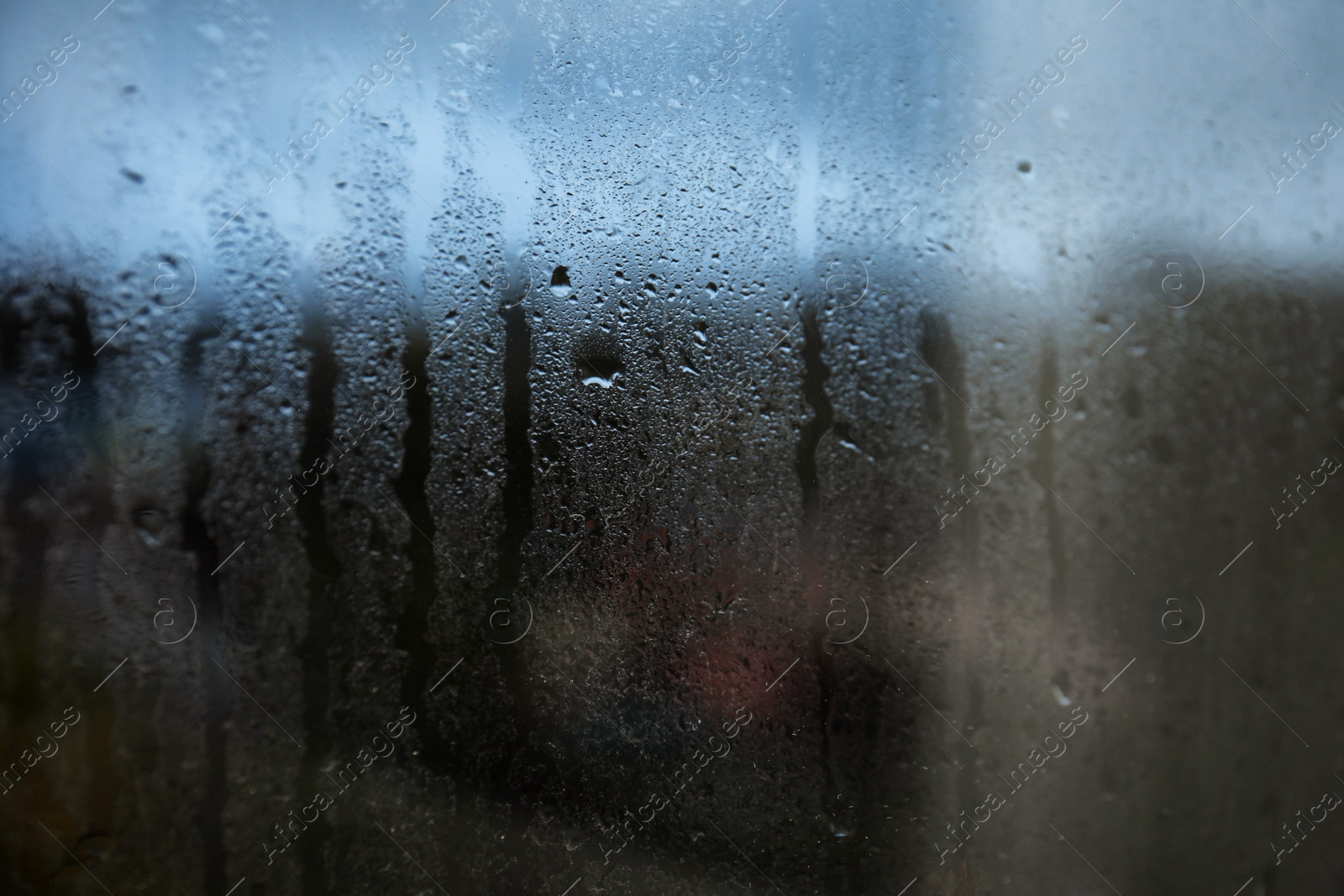 Photo of Rain drops on window glass as background