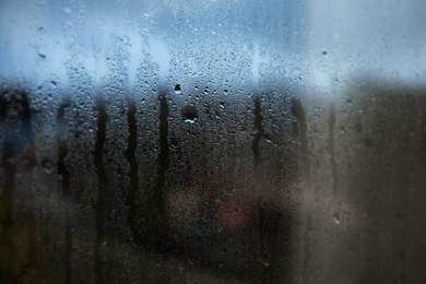 Photo of Rain drops on window glass as background