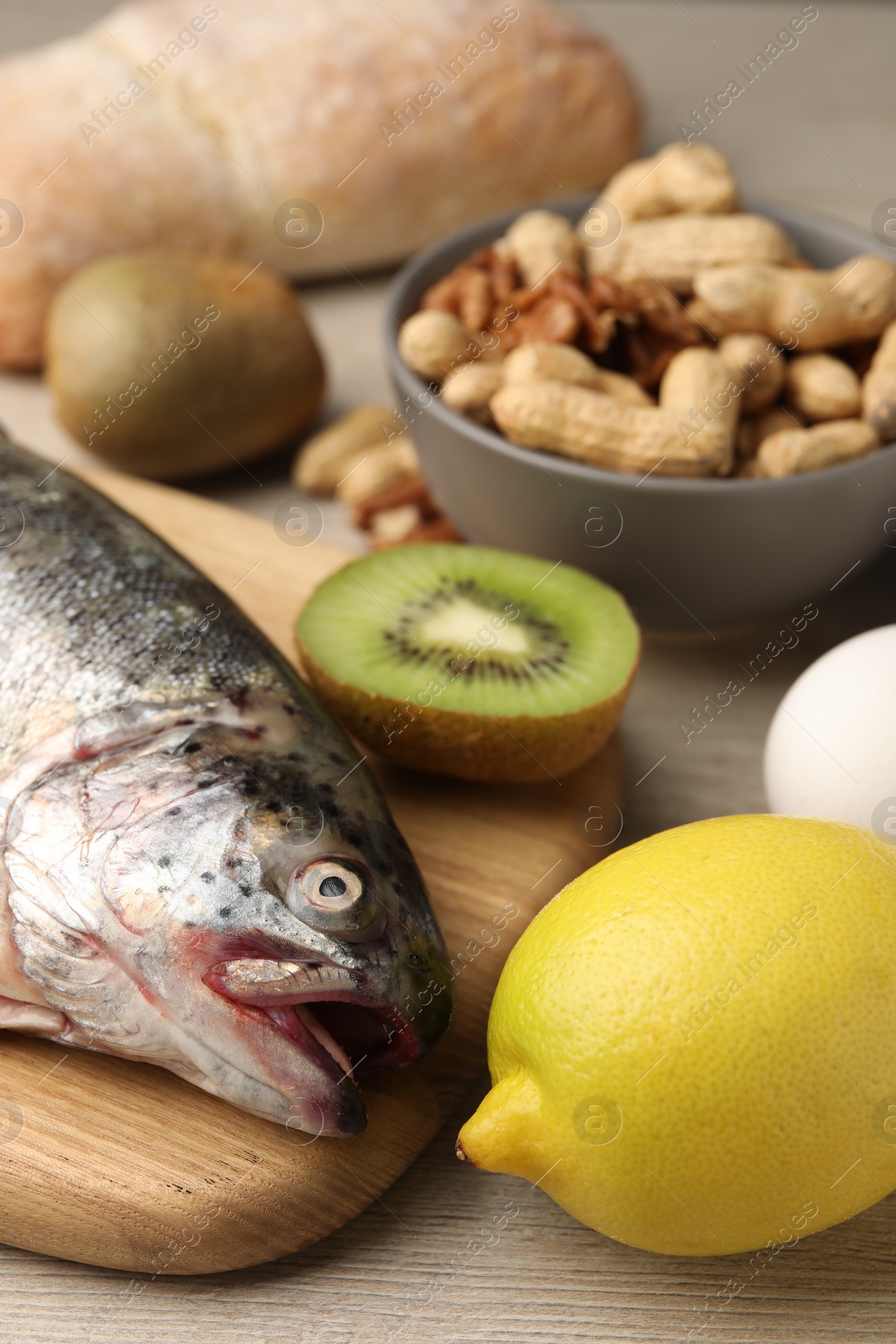 Photo of Allergenic food. Different fresh products on wooden table, closeup