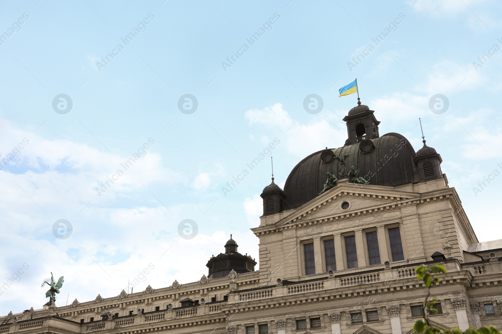 Photo of LVIV, UKRAINE - MAY, 04, 2022: Theatre of Opera and Ballet against cloudy sky, low angle view