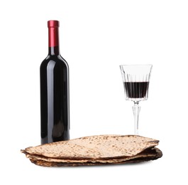 Photo of Tasty matzos and wine on white background. Passover (Pesach) celebration