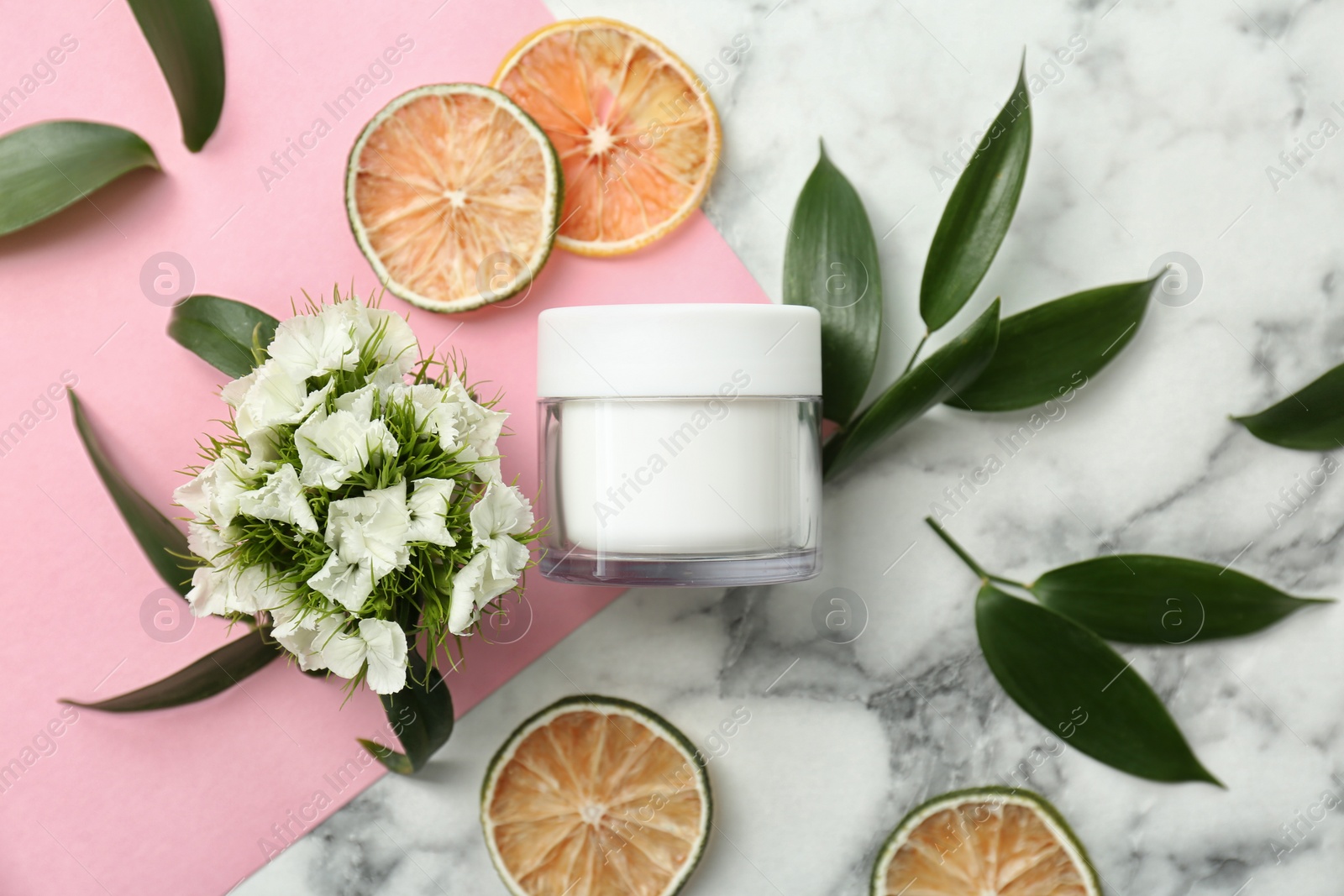 Photo of Beautiful composition with jar of cream on colorful background, flat lay