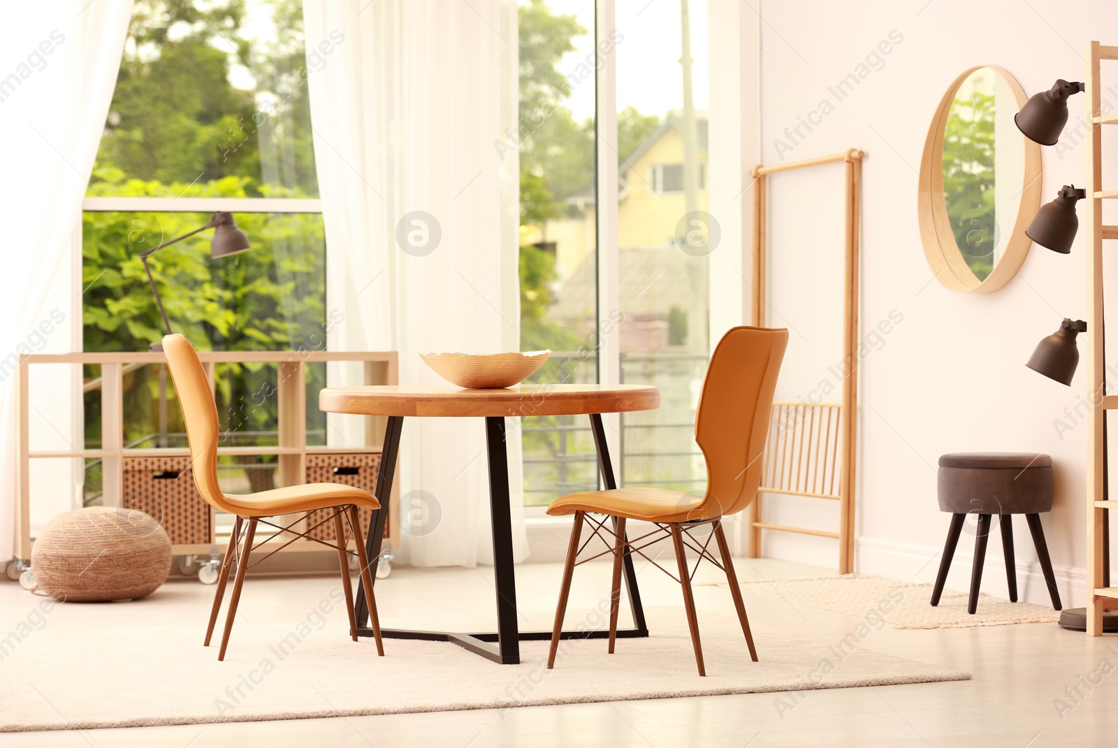 Photo of Modern dining room interior with table and chairs