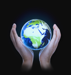 Image of Man holding Earth on dark background, closeup