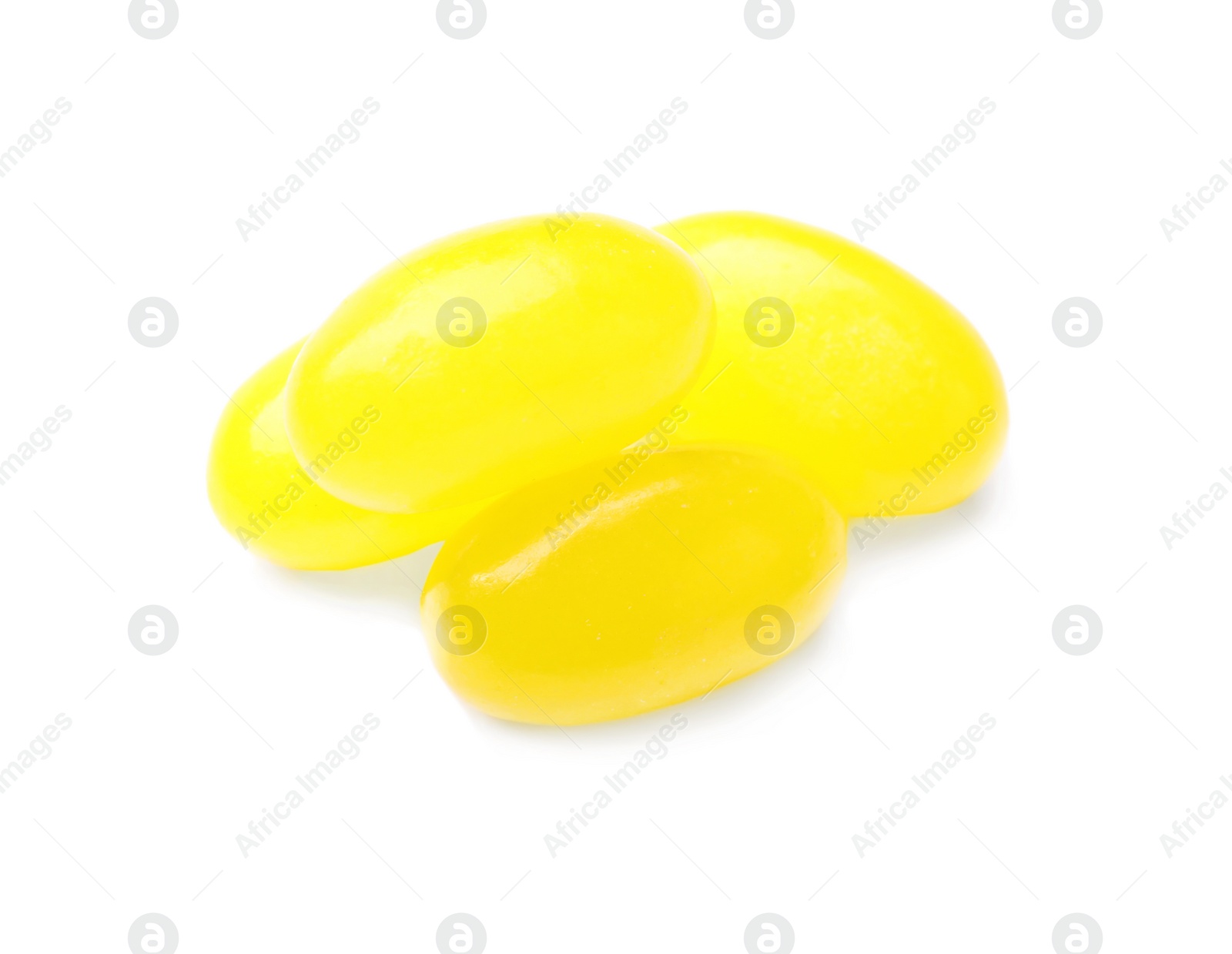 Photo of Tasty small lemon drops isolated on white