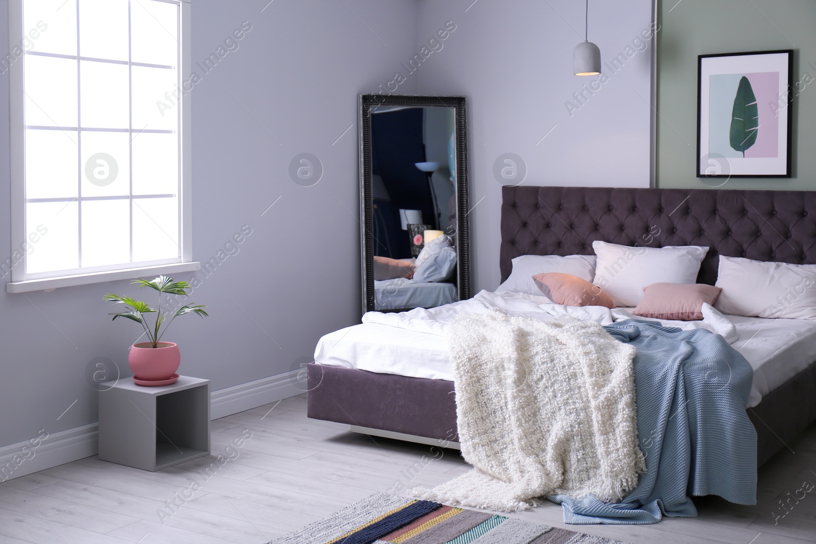 Photo of Stylish room interior with comfortable bed